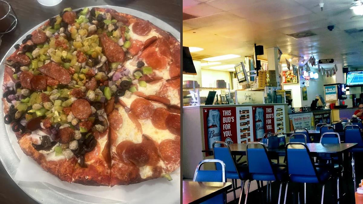 Pizza restaurant dining area with simple tables.