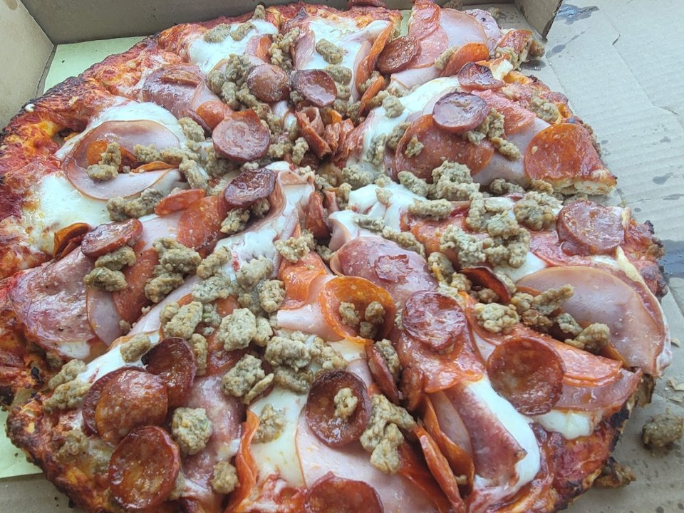 Family-friendly pizzeria with game machines.